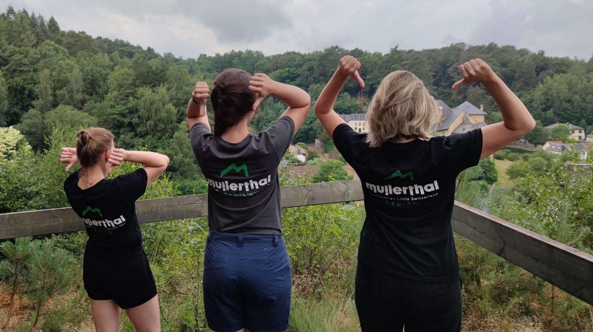 Three employees of the Office Régional du Tourisme - Région Mullerthal with the logo on their shirts