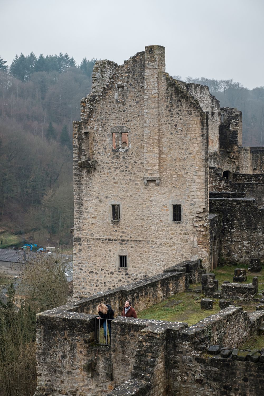 Visitors exploring the ruins of Larochette Castle