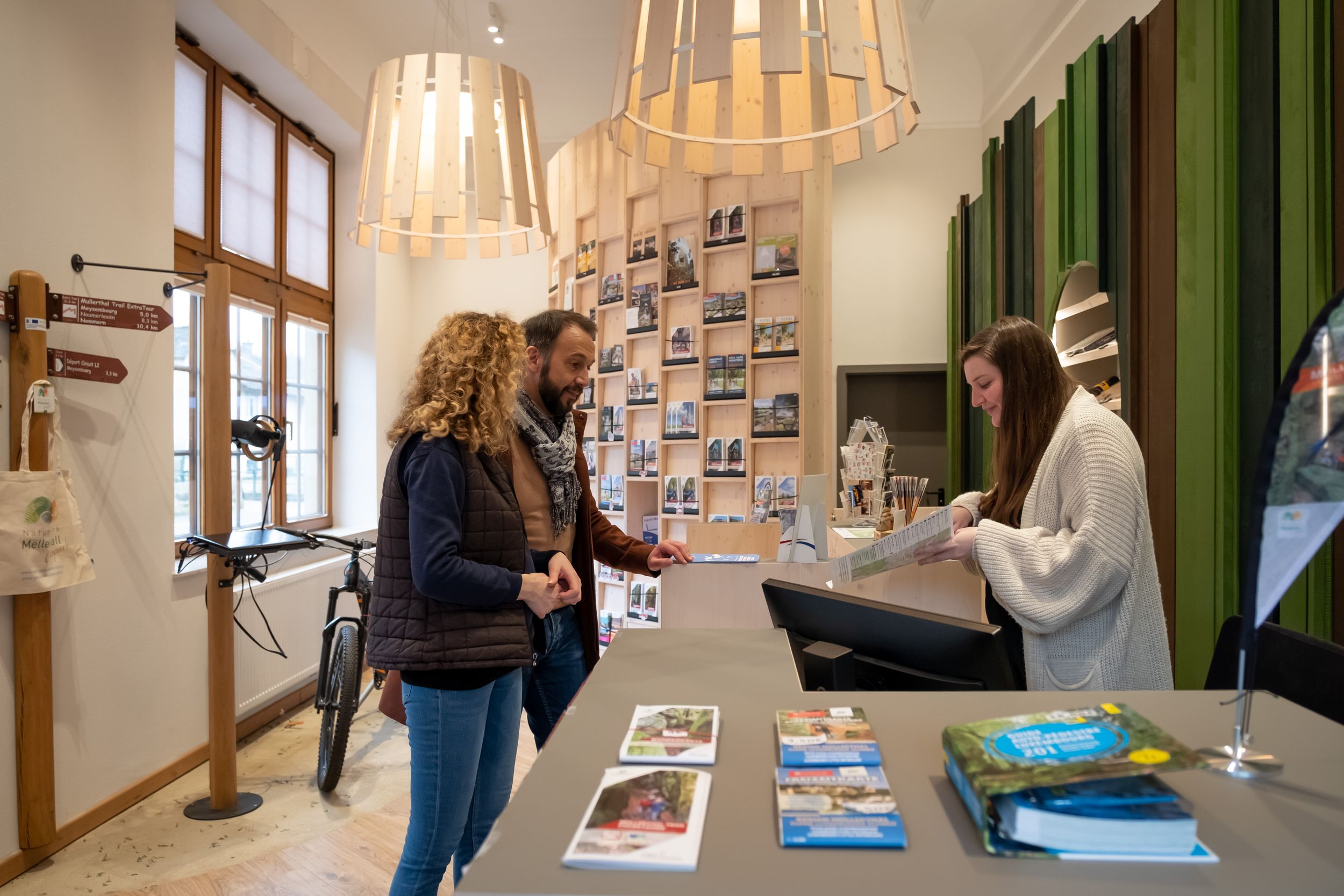 Visitors receiving advice inside Tourist Office Larochette