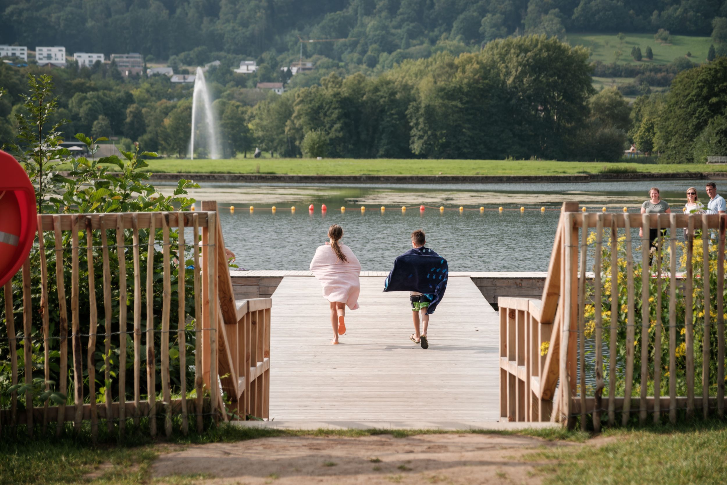 People swimming in Echternach lake during summer