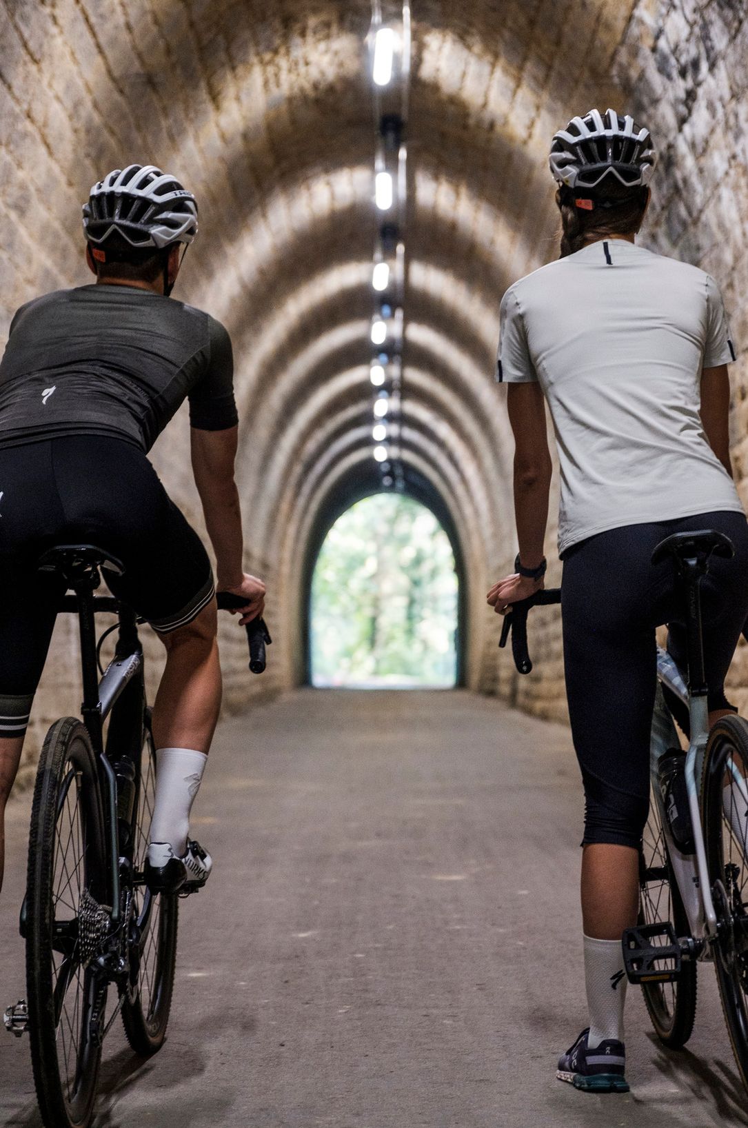 Two cyclist riding trough the "Becher Tunnel"