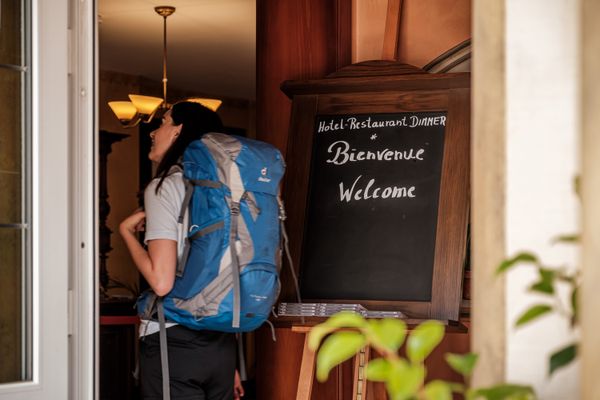 A person entering Hotel Dimmer