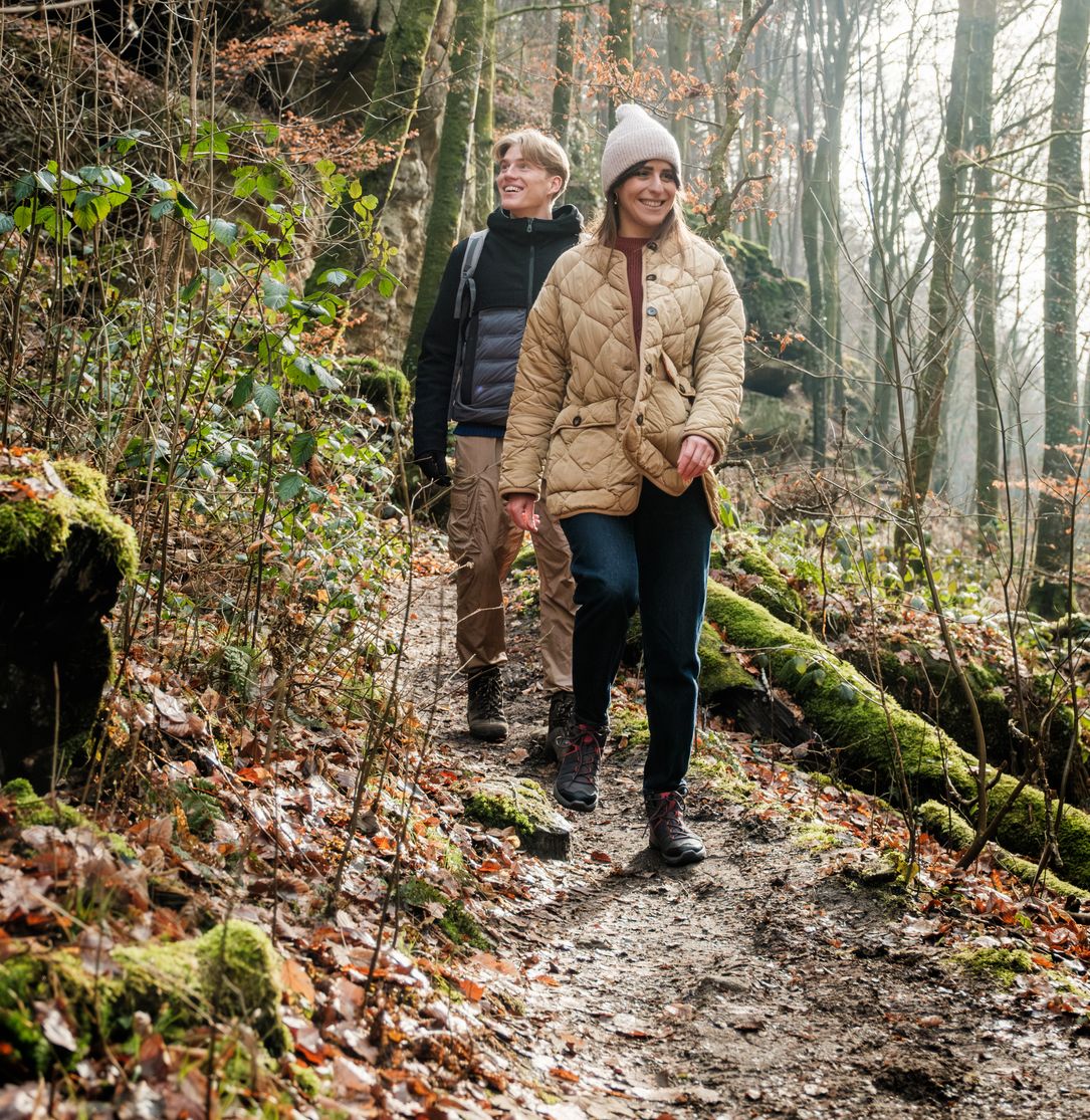 Hikers on the Mullerthal Trail Route 2 in Scheidgen near the "Härgottskapp"