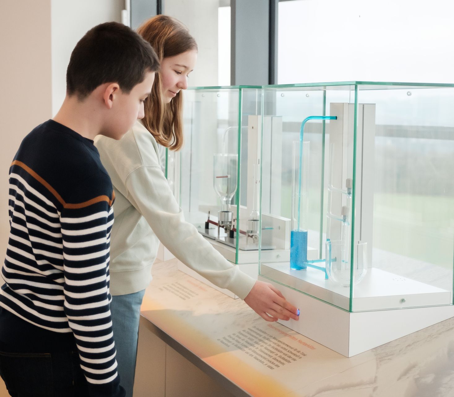 Kids exploring an interactive station inside the Aquatower in Berdorf